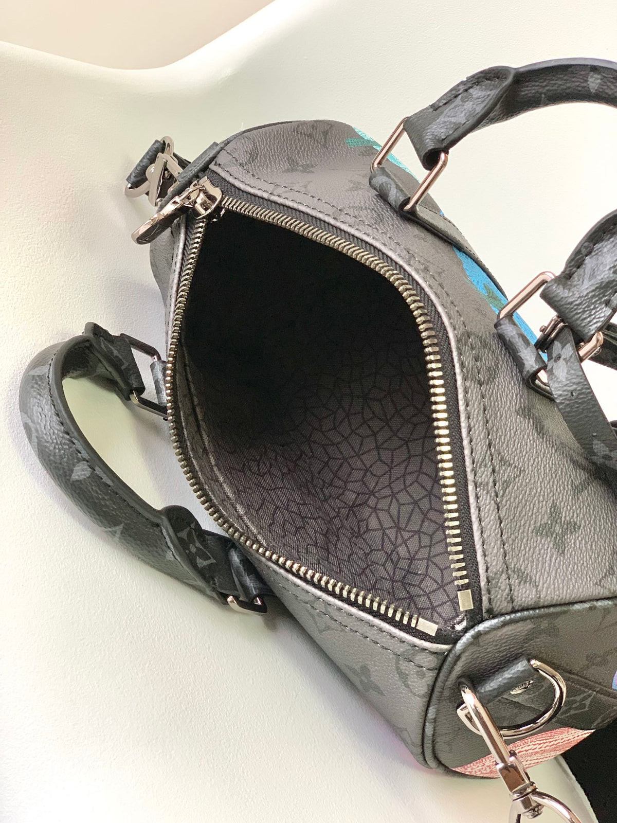 LOUIS VUITTON KEEPALL BANDOULIÈRE 21 IN MULTICOLOR CALFSKIN